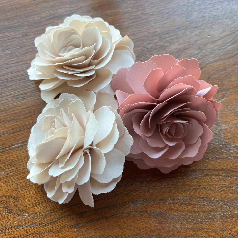 Three (3) silk flower ornaments for hair, jacket, blouse. Two ivory, one pink